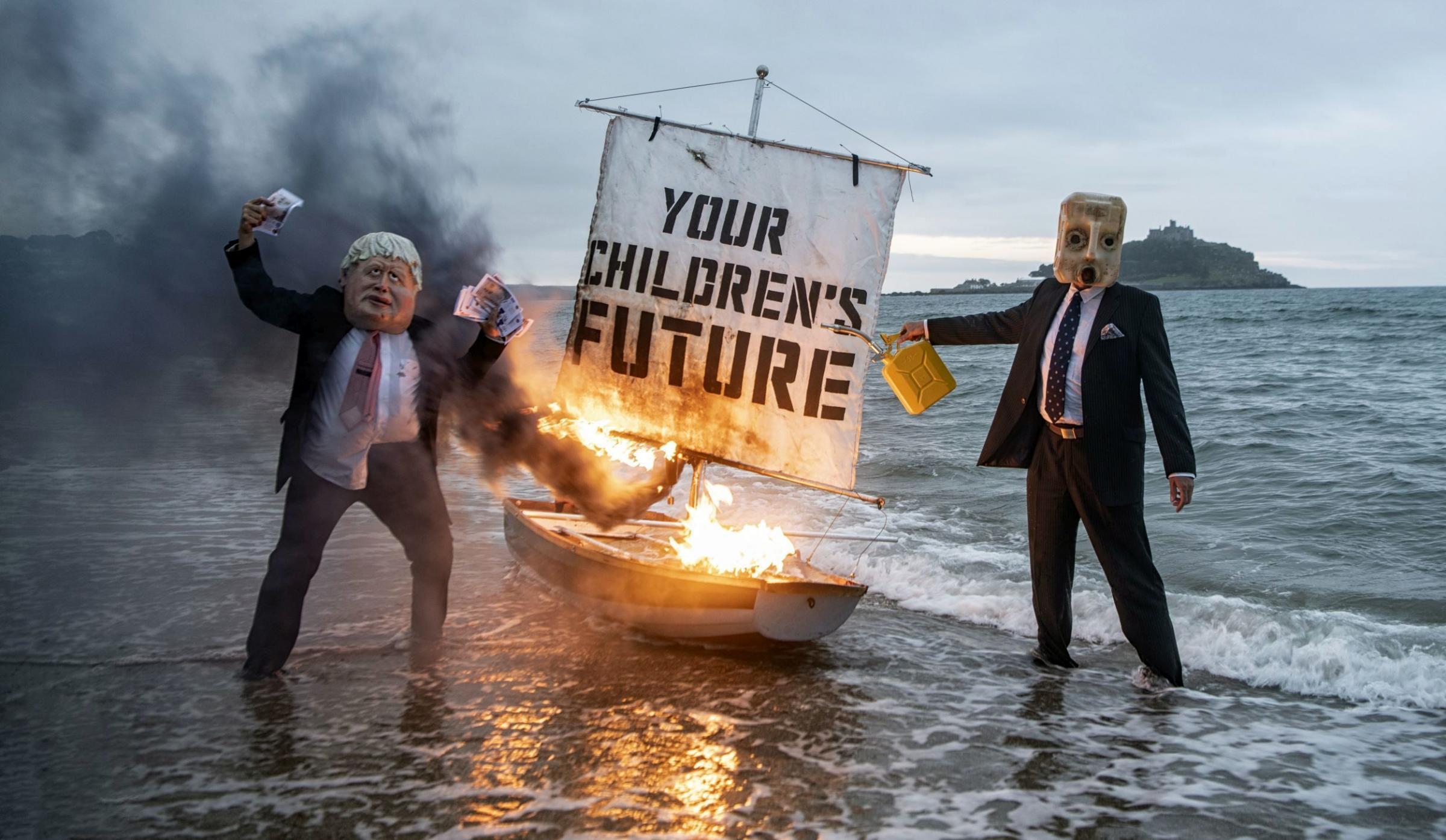 A boat with the words Your childrens future burns in the protest. Picture: Guy Reece