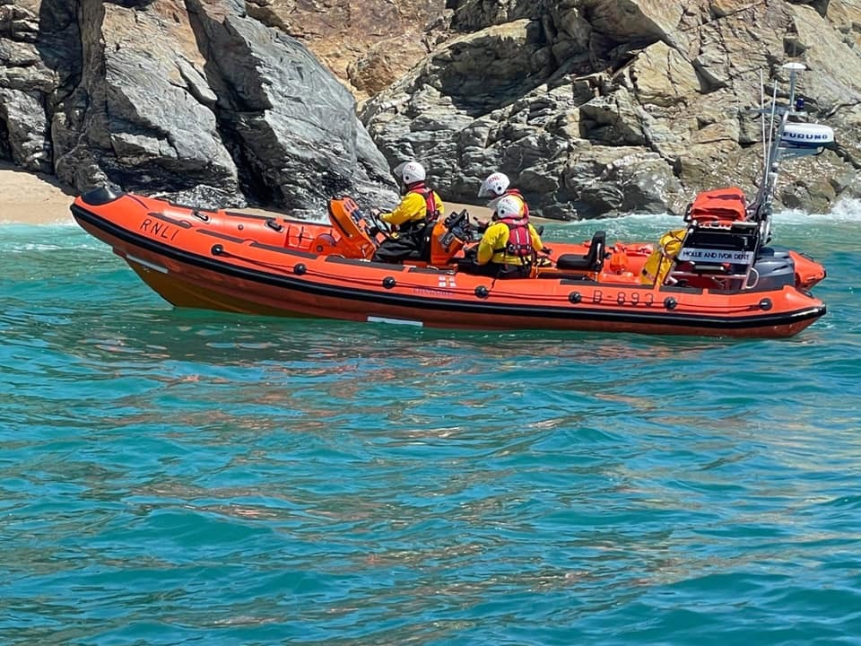 Rescue services were called to the beach near Porthleven after the diog owner was cut off by the tide