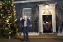 Boris Johnson speaking outside a festive Number 10 Downing Street. Credit: PA