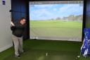 Picture: The state of the Art Golf Simulator. Here we see club Professional Nick Rogers teeing off on the 18th at St Andrews.