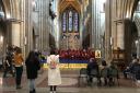 Tanya and Akim watch the choir from the two seats on the right as the choristers' perform Ave Maria