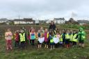 Shells Class from Mullion Primary School visit Tregullas Farm to bury some large pants!