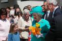 A young girl gets within touching distance of the Queen at the opening of the Tremough Campus in 2006