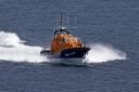 A fisherman clinging to his upturned boat was rescued by the Lizard Lifeboat