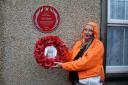 Pip Ainsworth lays a wreath in St James Street, Penzance in memory of her grandfather, firefighter Jack Michell. Credit: Howard Phillips