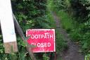 A sign warning of the footpath closure