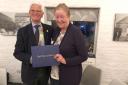 John Notley, Helston Rotary Club president, presents Amanda Boxer with the Paul Harris Fellowship Award