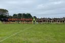 With only fifteen players available they stood in solidarity as the team paid tribute to the late Terence Pond