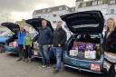 Members of A2B Taxi with three cars full of donations for DISC Newquay