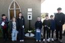 Children with their letters ready to be posted into the 'Letters to Heaven' post box in Porthleven