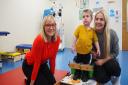 Louise Minchin, with Freddie Tierney, aged two, and mum Victoria Barker at The Movement Centre.