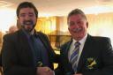 Ed Oxford presents Mullion Golf Club captain Wilf Hutchinson with the coveted Coverack Masters green jacket