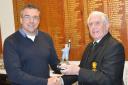 Steve Jones (left) receiving the Winter League Trophy form Falmouth Golf Club Captain William McLean.