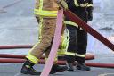 Two unconscious people rescued from smoke-filled flat by firefighters