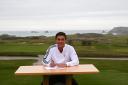 George Leigh signs his scholarship papers at his home course of Trevose