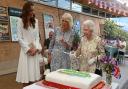 The Queen’s use of the sword amused Kate and Camilla. Picture: Oli Scarff/PA