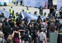 Kill The Bill protestors confront the police outside the Maritime Museum Media centre