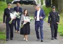 Home Secretary Priti Patel joins Devon and Cornwall Police chief constable Shaun Sawyer and local Labour MP Luke Pollard to lay flowers in Plymouth (Ben Birchall/PA)