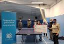 Cheque presentation: from left, Simon Berryman, Glenn Wilkinson (Co-op Regional Manager), Richard May (Dracaena Centre manager), Lesley Douce (table-tennis player), Lesley Perkins (Co-op Member Pioneer for Falmouth & Penryn), Dennis Williams