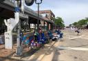 Empty chairs on the pavement after spectators fled (Lynn Sweet/Chicago Sun-Times/AP)