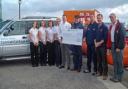 The Cornish Cottages team and owner Peter Collins present a cheque to Andrew Putt, Dan Atkinson, Ned Nuzum and John Harris from the Lizard Lifeboat.