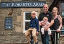 The Hodge family outside their new pub