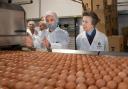 Dean Pink (Head of Production) shows HRH The Princess Royal the egg packing line