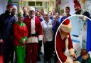 Royal Cornwall Hospital staff and sailors from RNAS Culdrose join Father Christmas and his elf for a picture