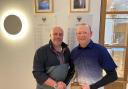 Falmouth Golf Club captain Pete Lewis (left) presenting the Winter league trophy to Mike Elliott