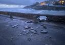 Porthleven's harbour wall finally gave way to the power of the sea on Monday