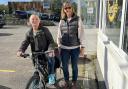 Kevin picks up his new bike from Falmouth Cycles with Michelle