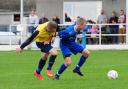 Mike Brewer (left) and Mark Goldsworthy battle for the ball during Saturday's cup game. Picture: PHIL RUBERRY