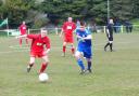 Josh Burton, wearing blue, during his time at Perranporth. He has rejoined Penryn Athletic
