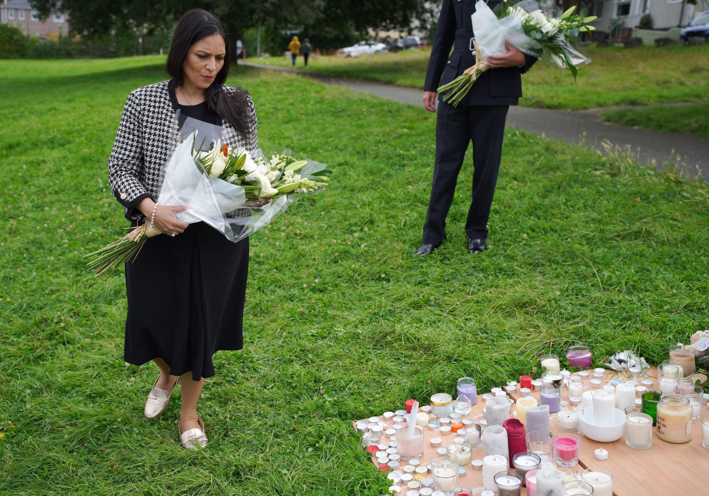 Home Secretary Priti Patel lays a bouquet of flowers with the tributes in Plymouth (Ben Birchall/PA)