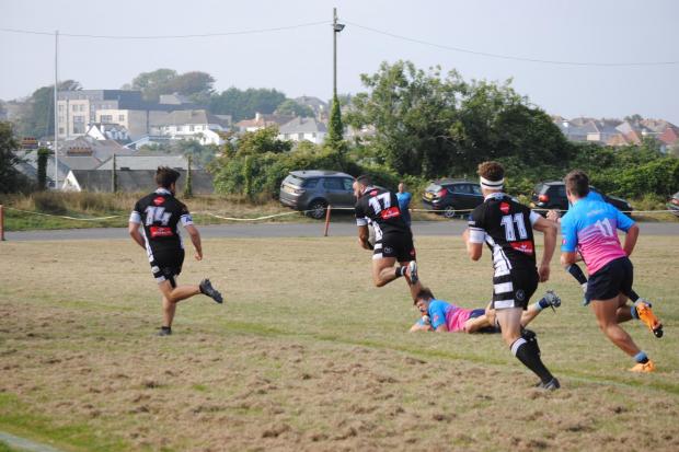 Toby Duncan breaks away for Falmouth against Tiverton