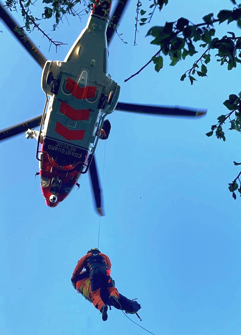 The injured walker is winched into the rescue helicopter Picture: Porthoustock Coastguard