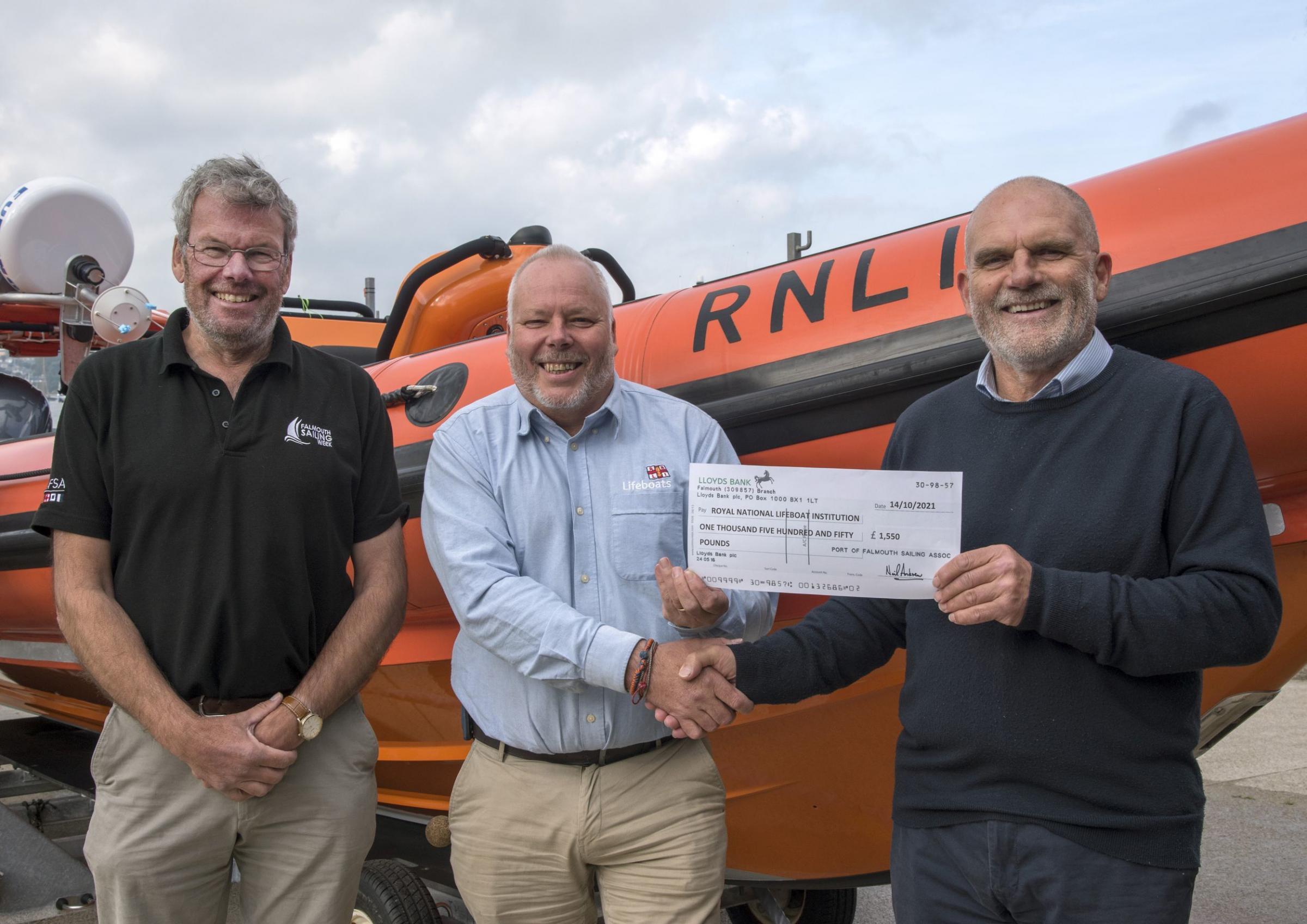 Nigel Sharp (chairman, PoFSA), Dave Nicoll (fundraising and partnership lead, RNLI) and Neil Andrew (chair of PoFSAs race management group)