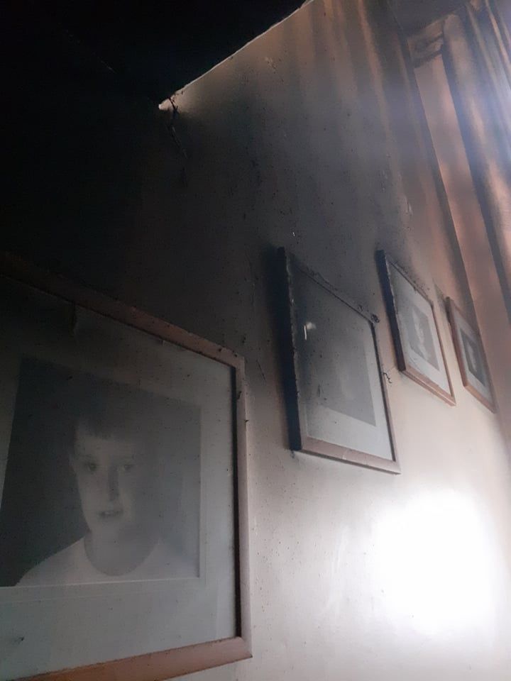 Smoke and soot damage to family photos of the children when they were younger