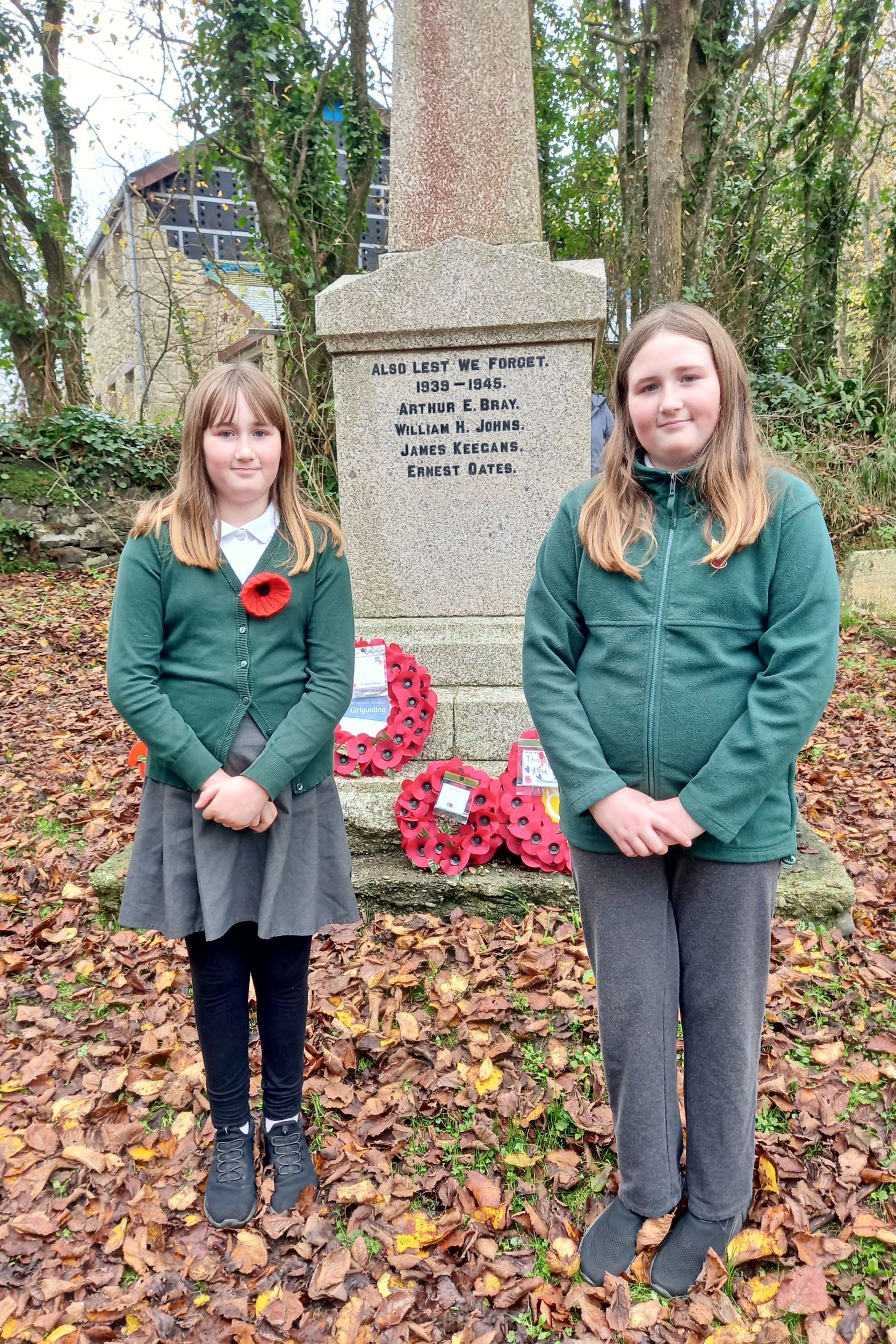 Lily and Grace laid the poppy wreath on behalf of Landewednack School and Little Lizards Nursery Picture: Lyndsay Bray
