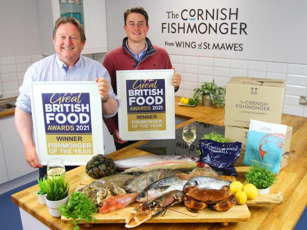Falmouth Packet: Father and son Rob (L) and Jack (R) Wing celebrate the awards with a selection of fresh Cornish fish.