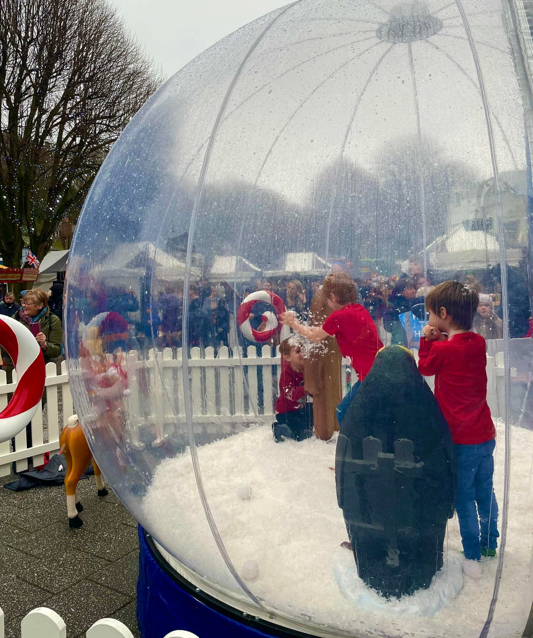 Getting to grips with the snow globe on The Moor. Pictures Falmouth Town Team