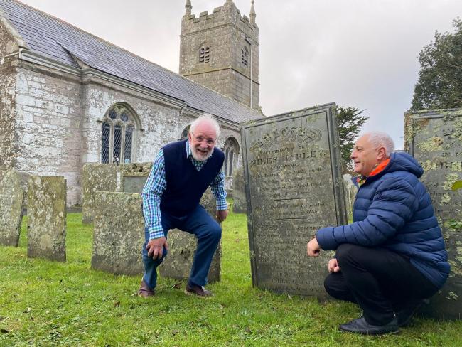 Barry West (right) and Christopher Marley at the grave of Miles Marley  Picture: SWNS