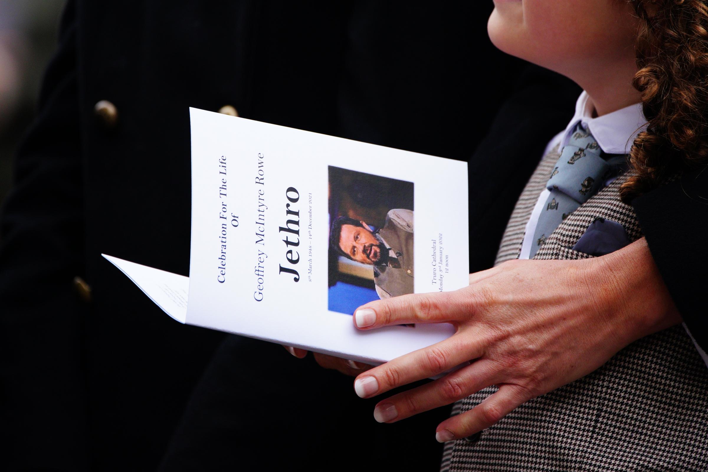 A mourner holds an order of service at the funeral of Cornish comedian Jethro at Truro Cathedral in Cornwall. Jethro, real name Geoffrey Rowe, died on December 14 after contracting Covid-19. Picture date: Monday January 3, 2022.