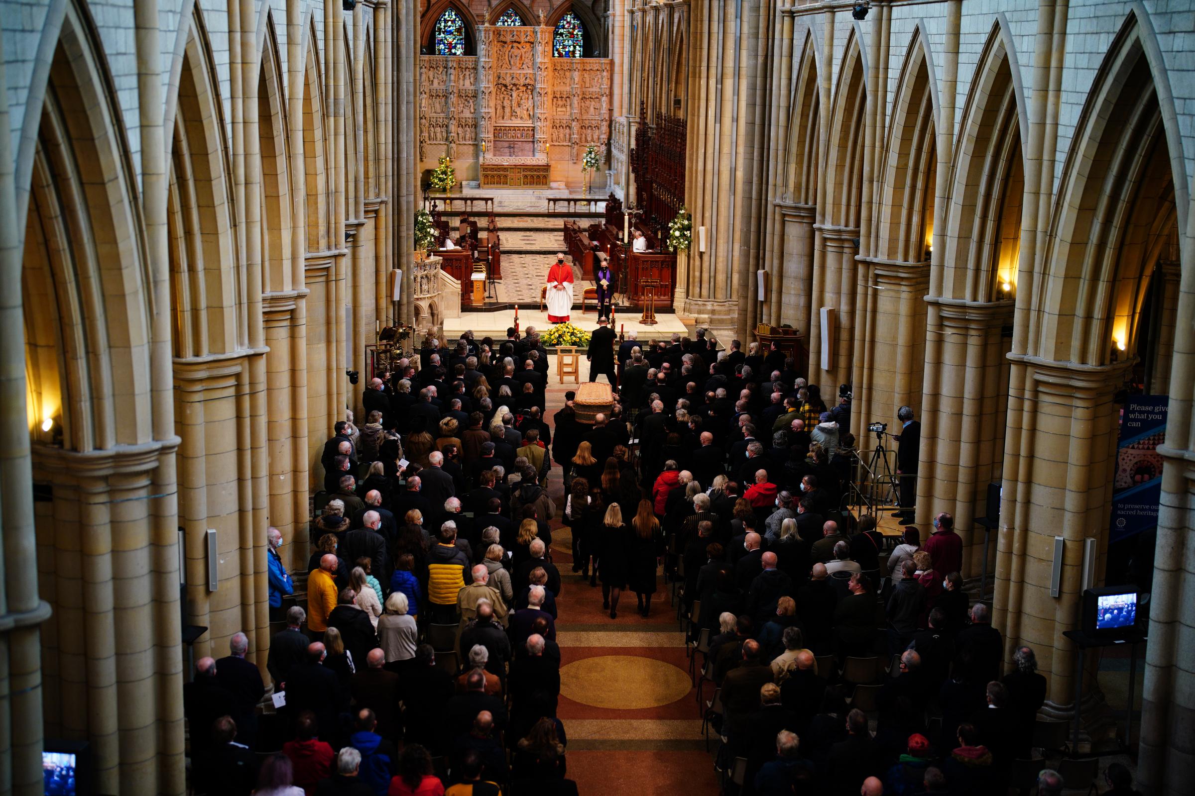 The coffin is carried into the funeral service of Cornish comedian Jethro at Truro Cathedral in Cornwall. Jethro, real name Geoffrey Rowe, died on December 14 after contracting Covid-19. Picture date: Monday January 3, 2022.