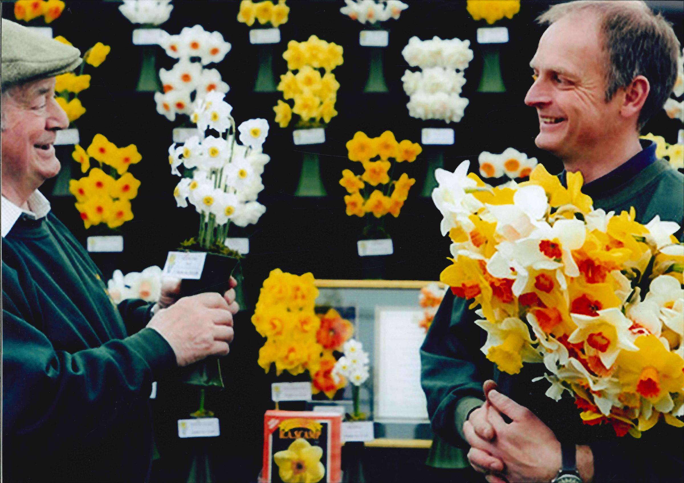 Ron Scamp , retired show president with son Adrian on their daffodil trade stand at Princess Pavilion 