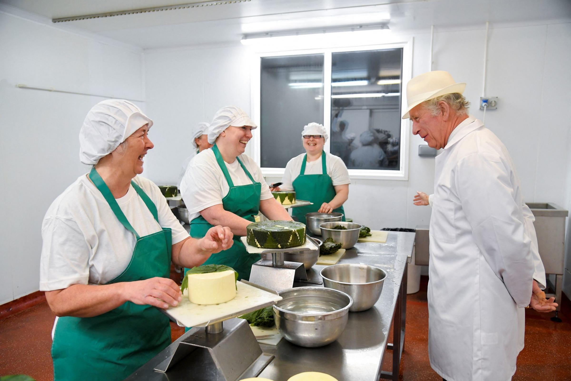 Prince Charles meets the team at Lynher Dairies at Ponsanooth, makers of Cornish Yarg Picture: PA Wire/PA Images