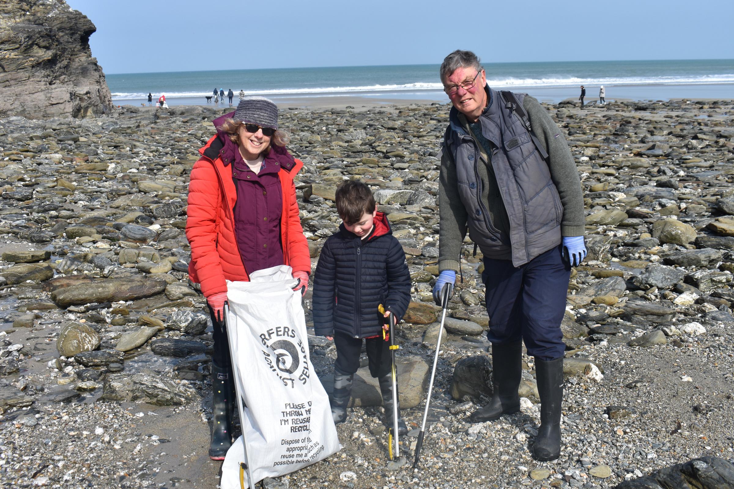 Phil Tina and Stanley Rowe litter picking on Portreath beach
