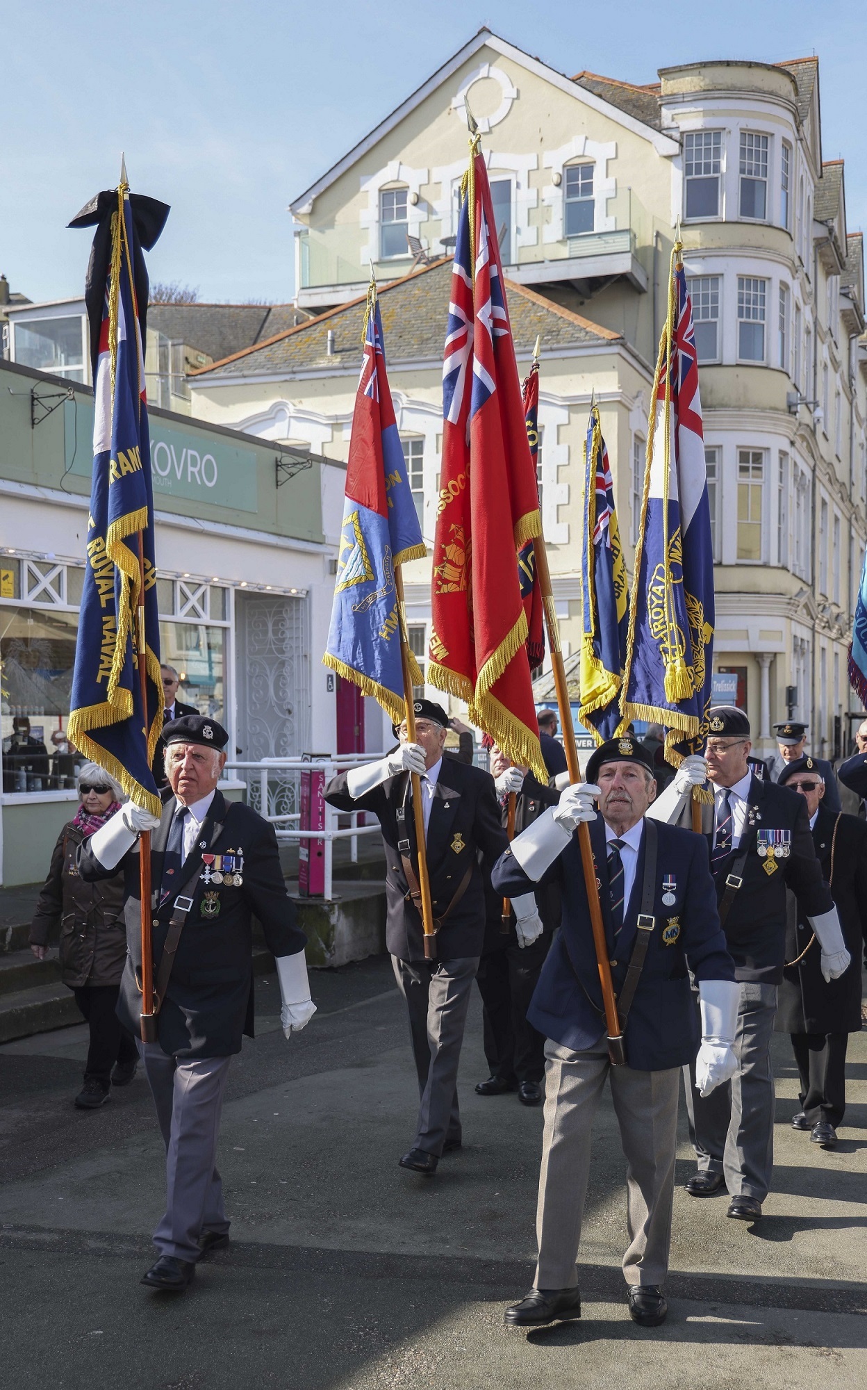 Pictured: Standard Bearers march through Falmouth town centre during the 80th memorial service marking the St Nazaire Raid. Credit: LPhot Dan Rosenbaum, RNAS Yeovilton