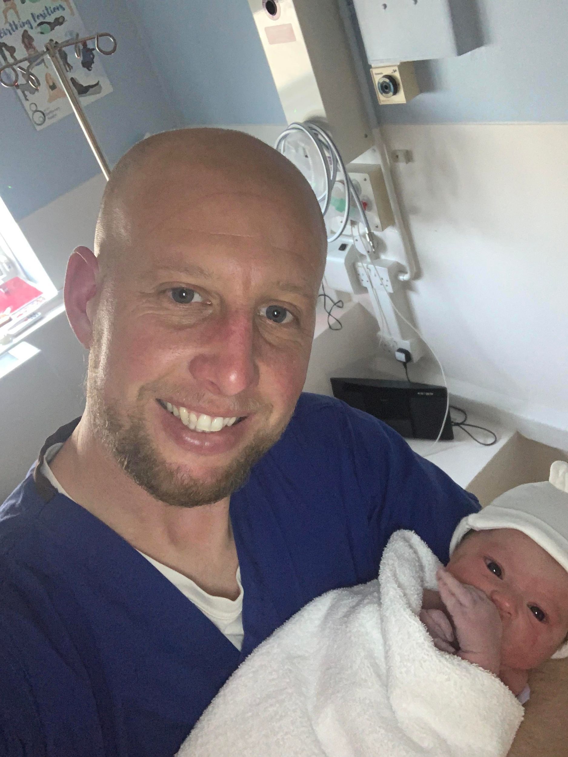 Craig with Ezrah just after he was born