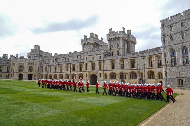 Falmouth Packet: The Earl of Wessex presents new colours to the Royal Gibraltar Regiment during a ceremony at Windsor Castle. Picture: PA